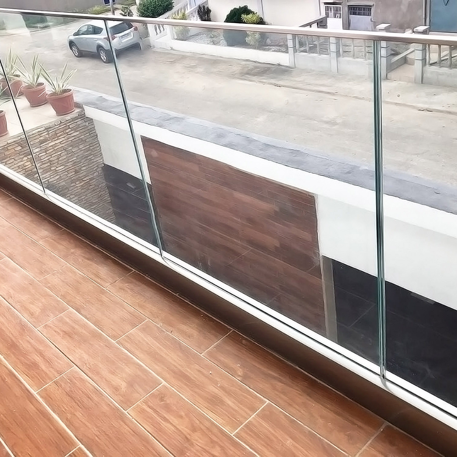Glass railing with slim slot tube