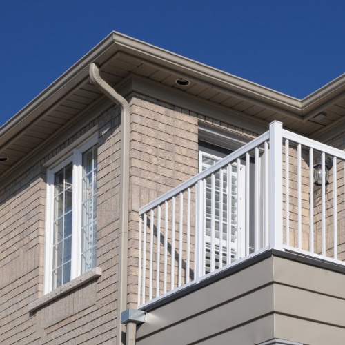 Section of a house with white balcony