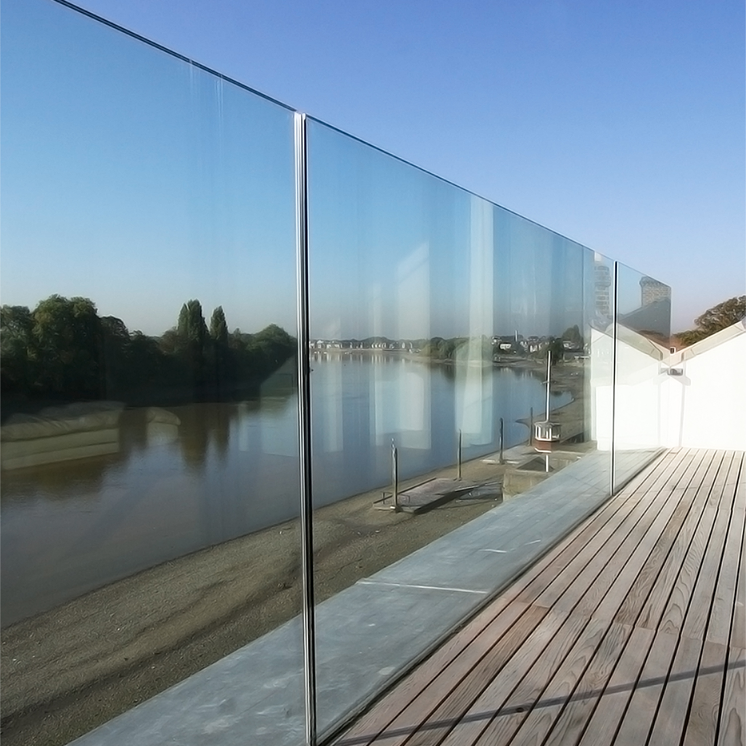Embedded glass railing on decking